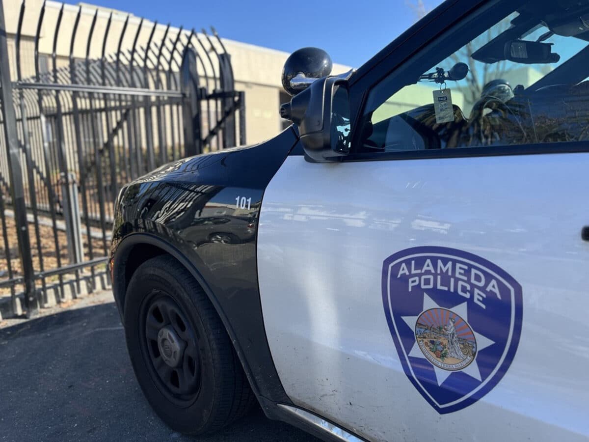 Alameda Post - An APD vehicle in front of a gate.