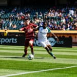 Alameda Post - an Oakland Roots and Sacramento Republic player both try to get control of the ball