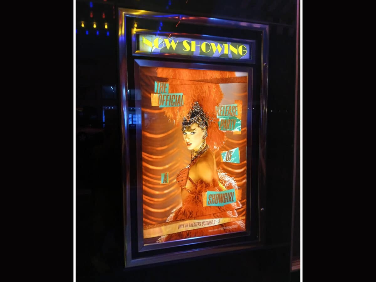 Alameda Post - A poster at a movie theater for Taylor Swift: The Official Release Party of a Showgirl.