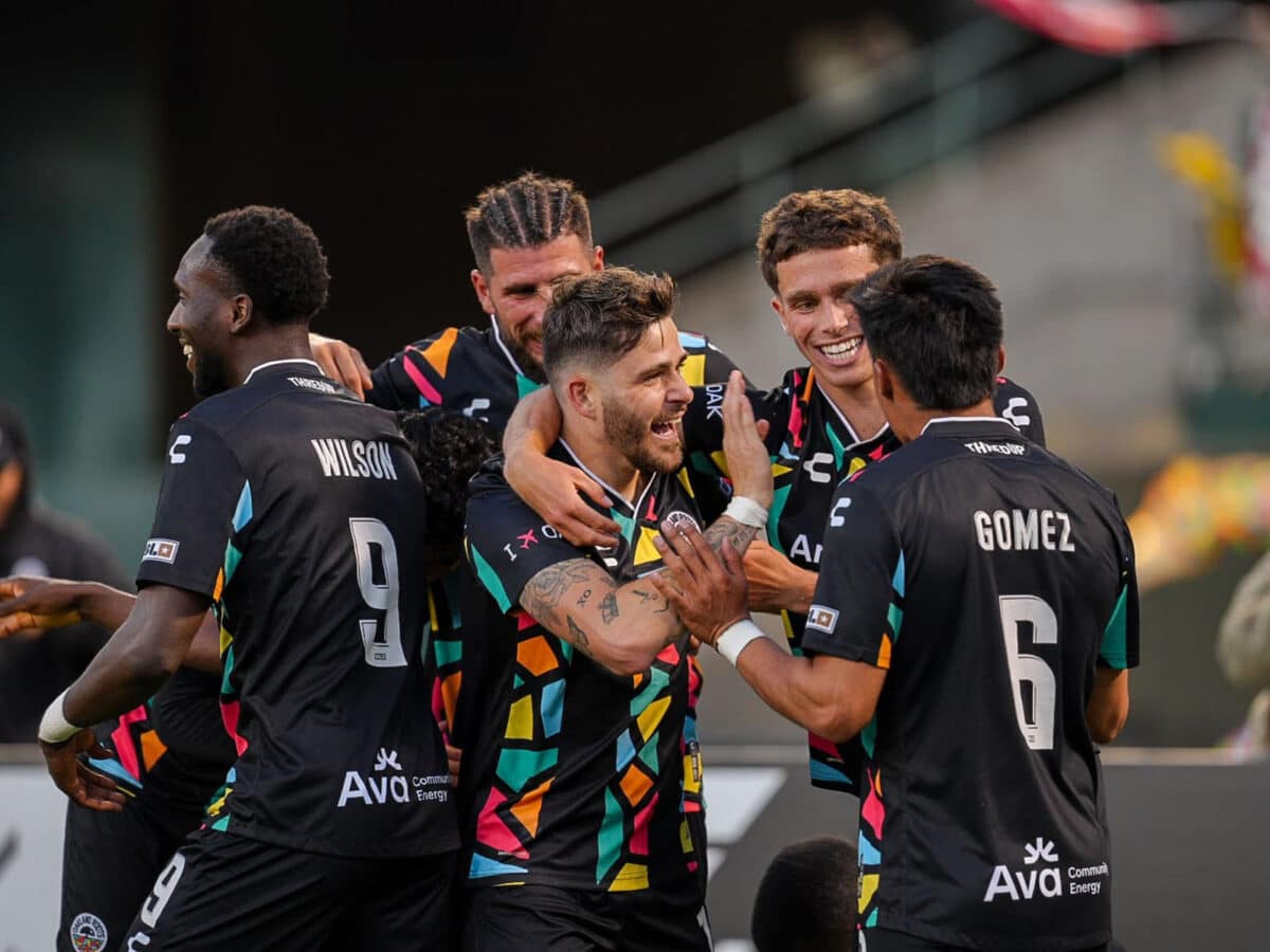 Alameda Post - Oakland Roots players congratulate each other in the match versus Detroit City FC