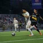 Alameda Post - an Oakland Roots player dribbles the ball against Pittsburgh Riverhounds SC