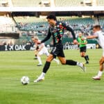 Alameda Post - an Oakland Roots player goes for the ball in the match against Colorado Springs Switchbacks FC