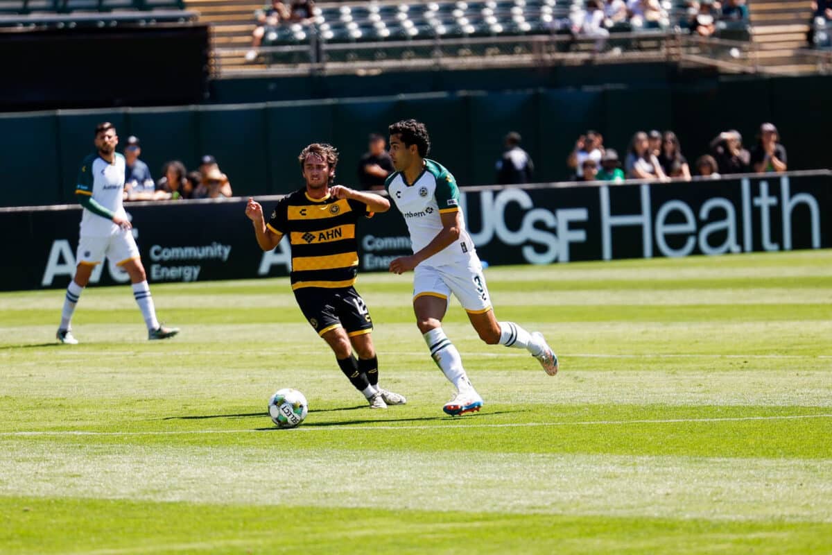 Alameda Post - a Roots player goes for the ball in a match against the Pittsburgh Riverhounds