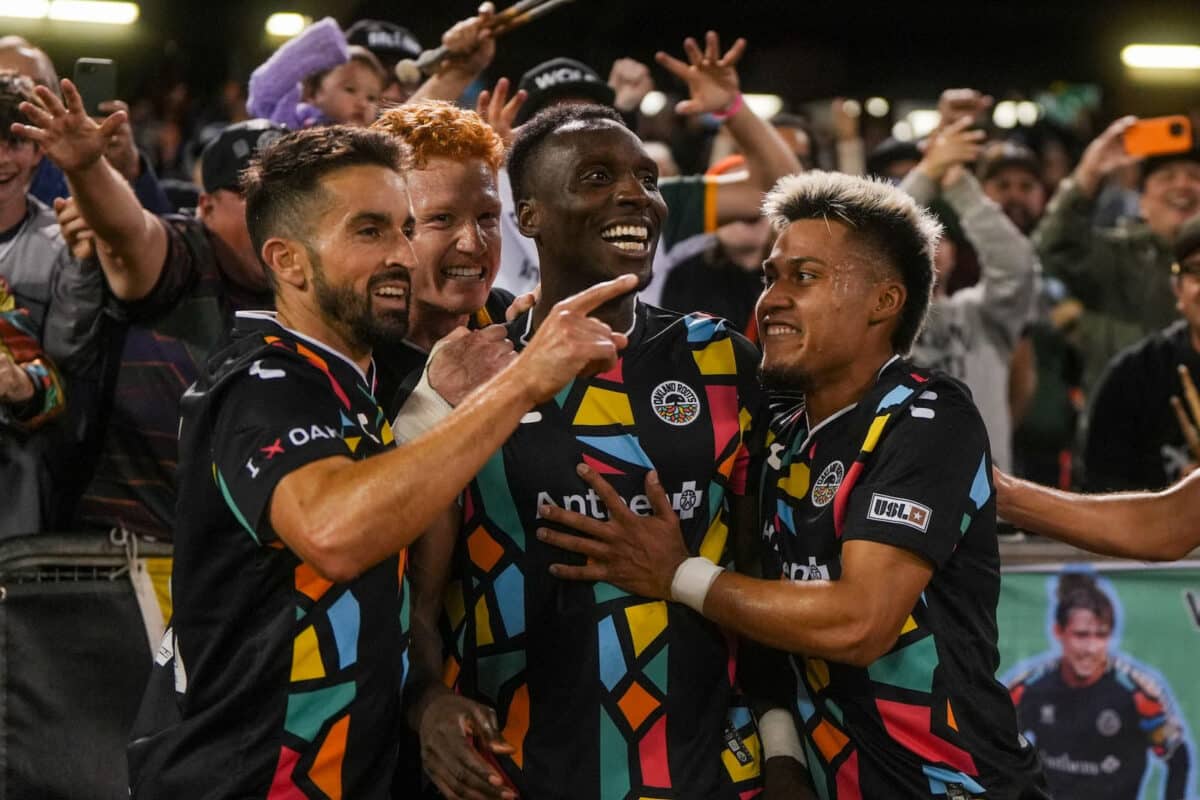 Alameda Post - Oakland Roots players smile together as the crowd cheers after their season finale against Lexington SC.