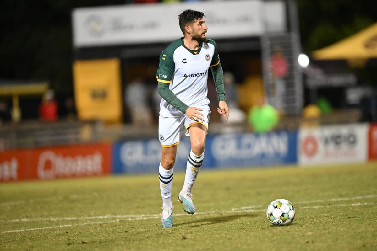 Alameda Post - an Oakland Roots player dribbles the ball in a match against Charleston Battery