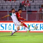Alameda Post - an Oakland Roots player goes for the ball in a match against Phoenix Rising FC