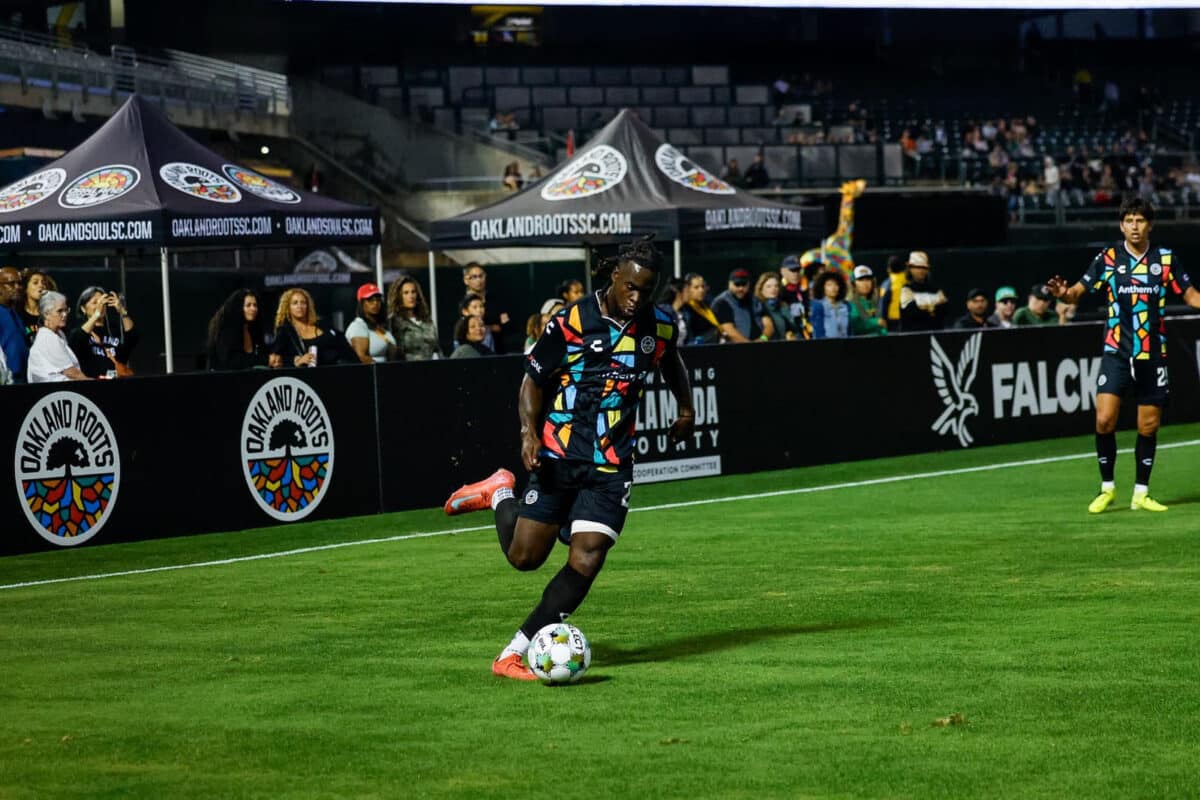 Alameda Post - an Oakland Roots player kicks the ball in a match against FC Tulsa