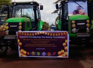 Alameda Post - two tractors with a sign that says "Tractors provider by the Rotary Foundation with support from Rotary Clubs of Alameda, Castro Valley..."