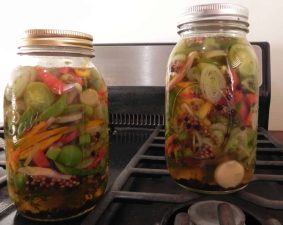 Alameda Post - Jars of colorful vegetables in a pickling liquid.