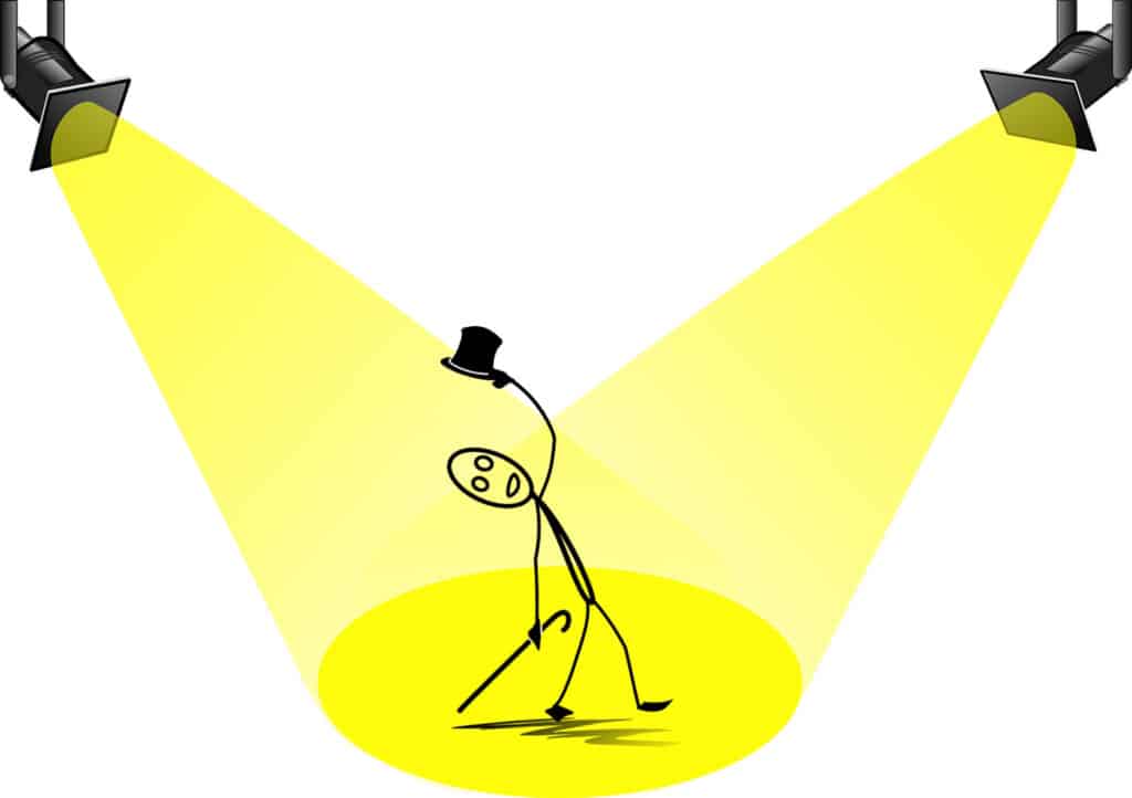 Alameda Post - a stick figure with a cane and top hat in the spotlight