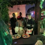 Alameda Post - Trick or treaters walk up to a candy bowl