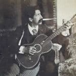 Alameda Post - a black and white photo of William F. Chipman holding a guitar