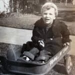 Alameda Post - a black and white photo of a young Phil Plant in a wagon